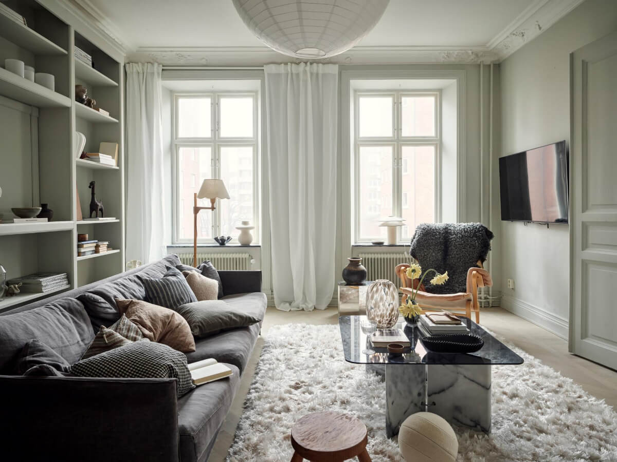A Light Scandi Apartment in a Former Stately Home 2 greige scandi living room large fluffy rug