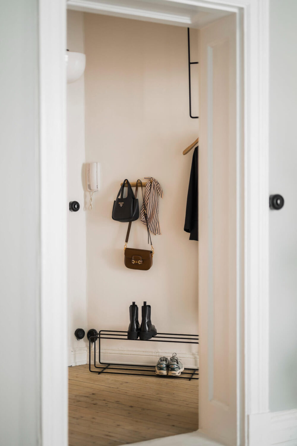 An Early 20th-Century Apartment with a Pink Kitchen 32 hall entry coat and shoe storage