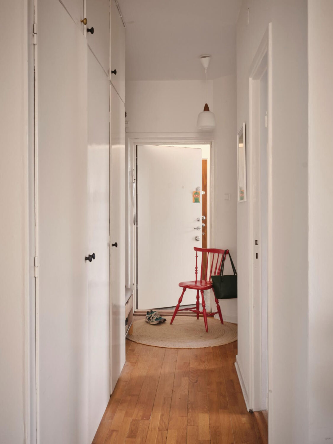 A Small, Light Swedish Apartment with Midcentury Features 21 hall original built-in wardrobes