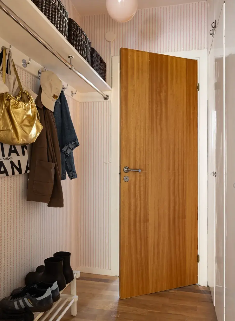 A Cozy Swedish Apartment in a 1950s Building 20 hallway striped wallpaper A Cozy Swedish Apartment in a 1950s Building