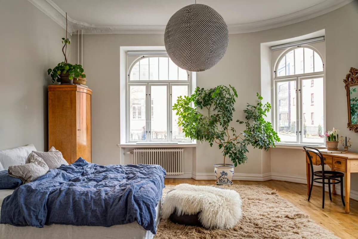 Large Rooms in an Art Nouveau Apartment in Sweden 17 large bedroom with arched windows and desk