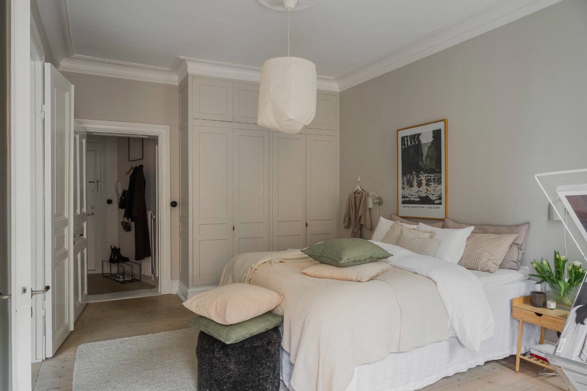 An Early 20th-Century Apartment with a Pink Kitchen 21 light bedroom built in wardrobes