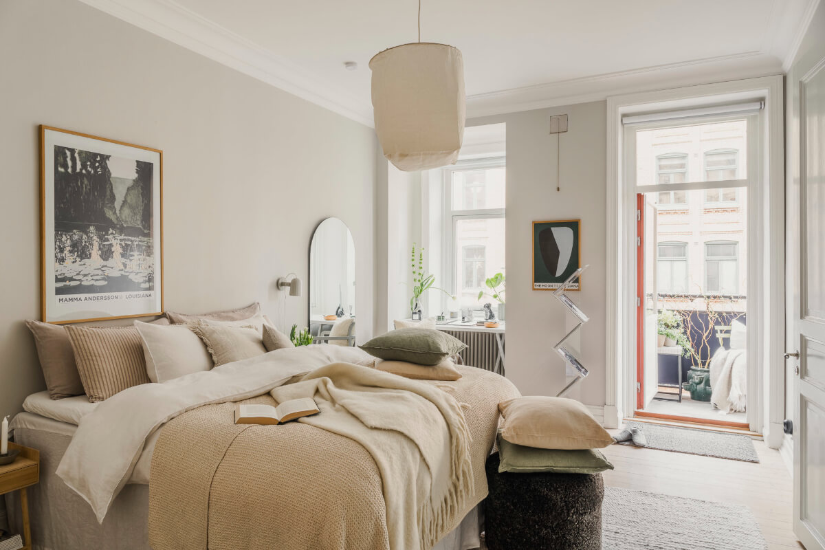An Early 20th-Century Apartment with a Pink Kitchen 11 light bedroom large windows mirror balcony