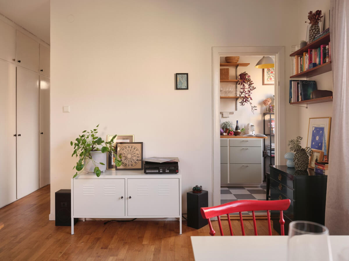 A Small, Light Swedish Apartment with Midcentury Features 11 living room view into kitchen