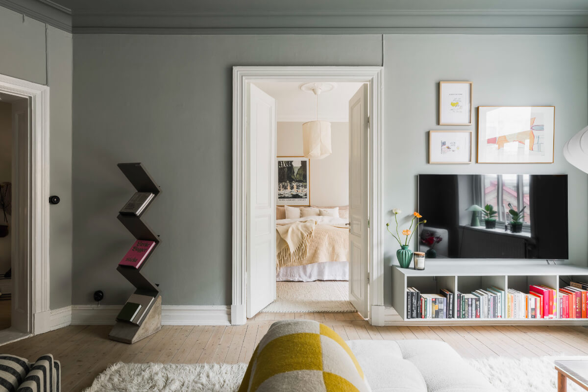 An Early 20th-Century Apartment with a Pink Kitchen 7 living room view to bedroom