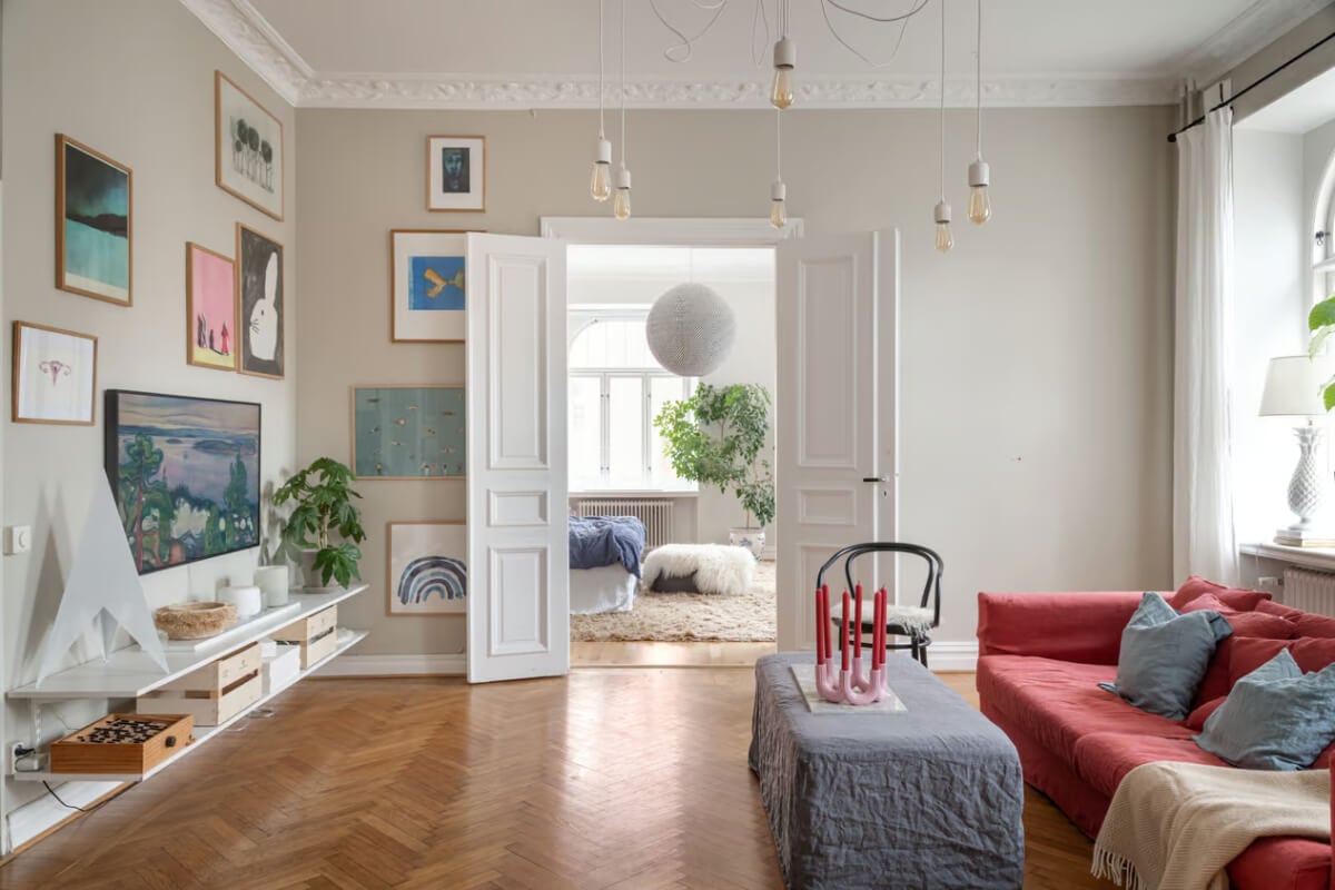 Large Rooms in an Art Nouveau Apartment in Sweden 4 living room with art and double wooden doors