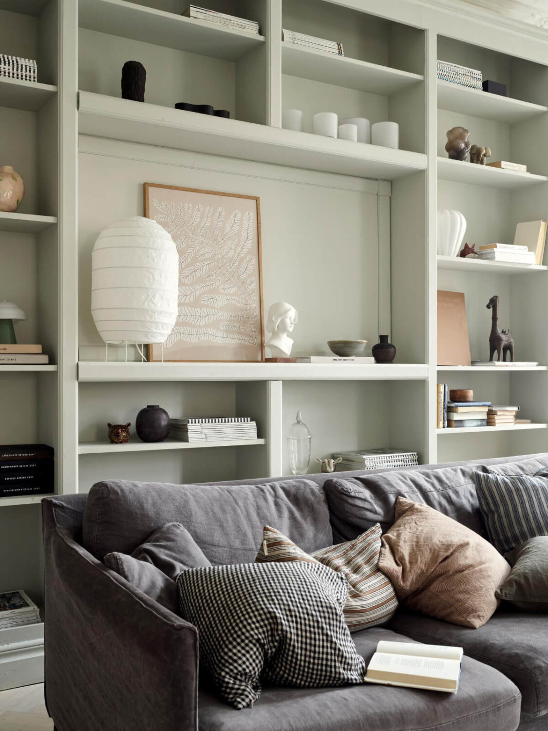 A Light Scandi Apartment in a Former Stately Home 5 living room with open cabinets