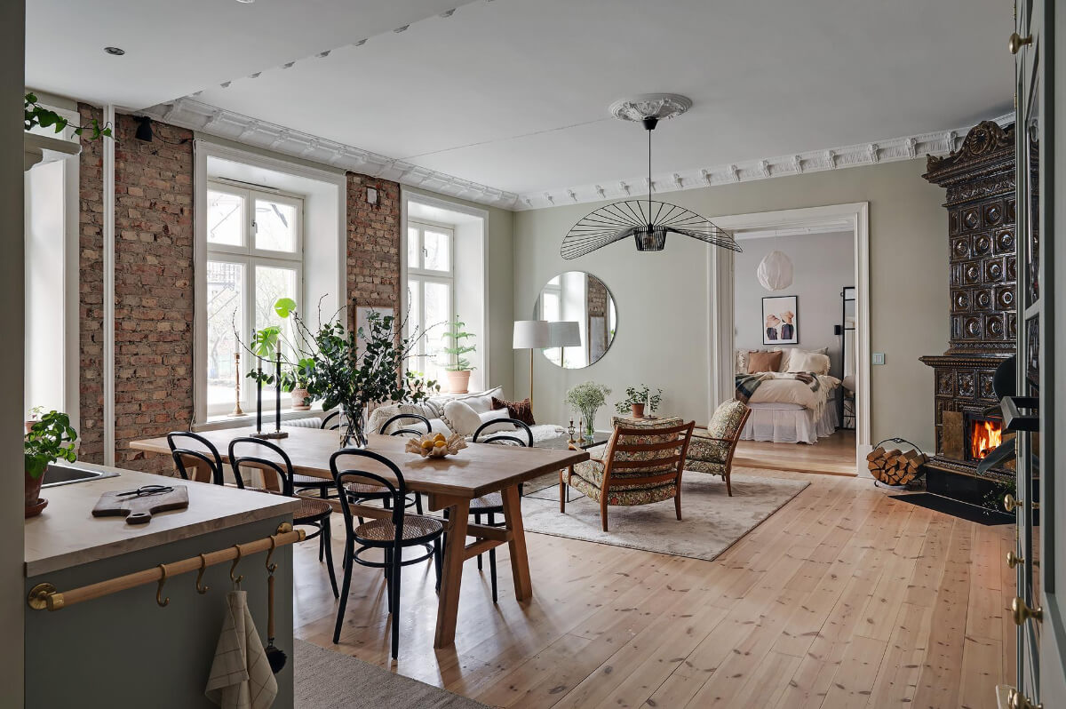 open plan kitchen living room exposed brick fireplace