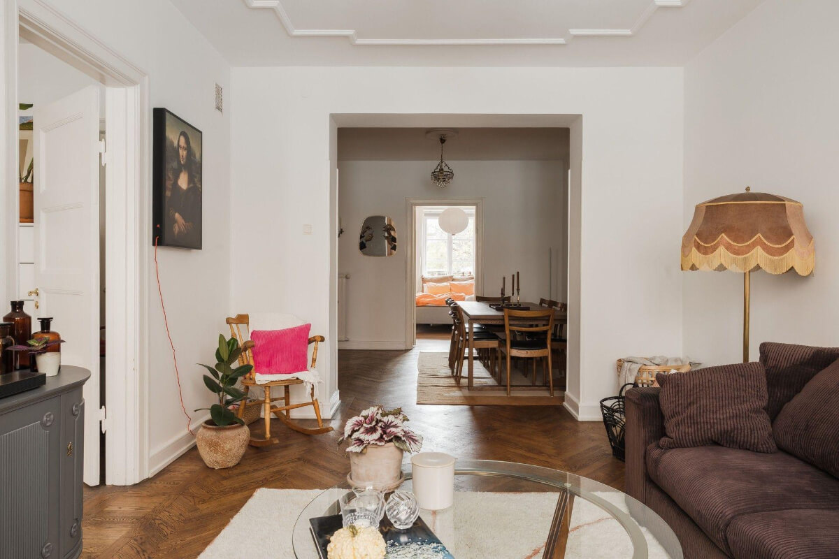 Natural Tones and Original Elements in a 1930s Apartment 3 open plan living room dining space with herringbone floor