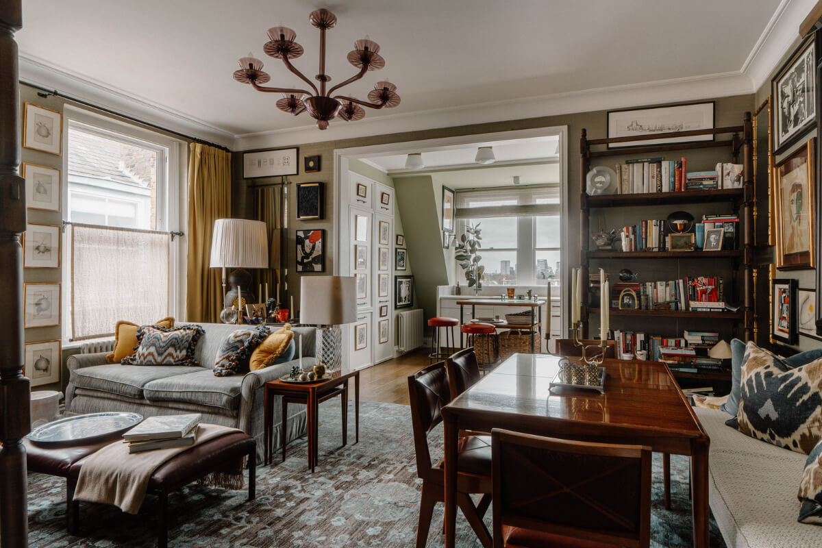 open plan living space with layered textiles and dining table