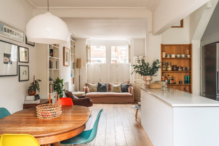 open plan living space wooden floor window shutters