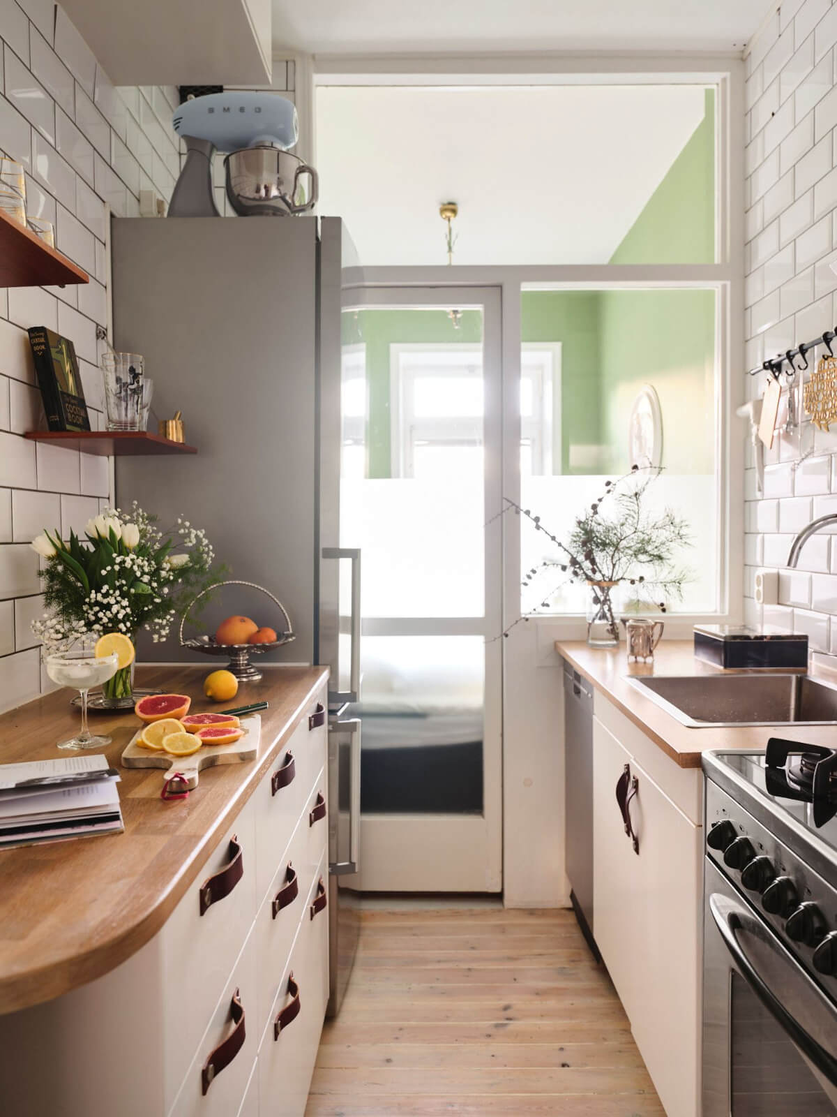 small galley kitchen white cabinets wooden countertop