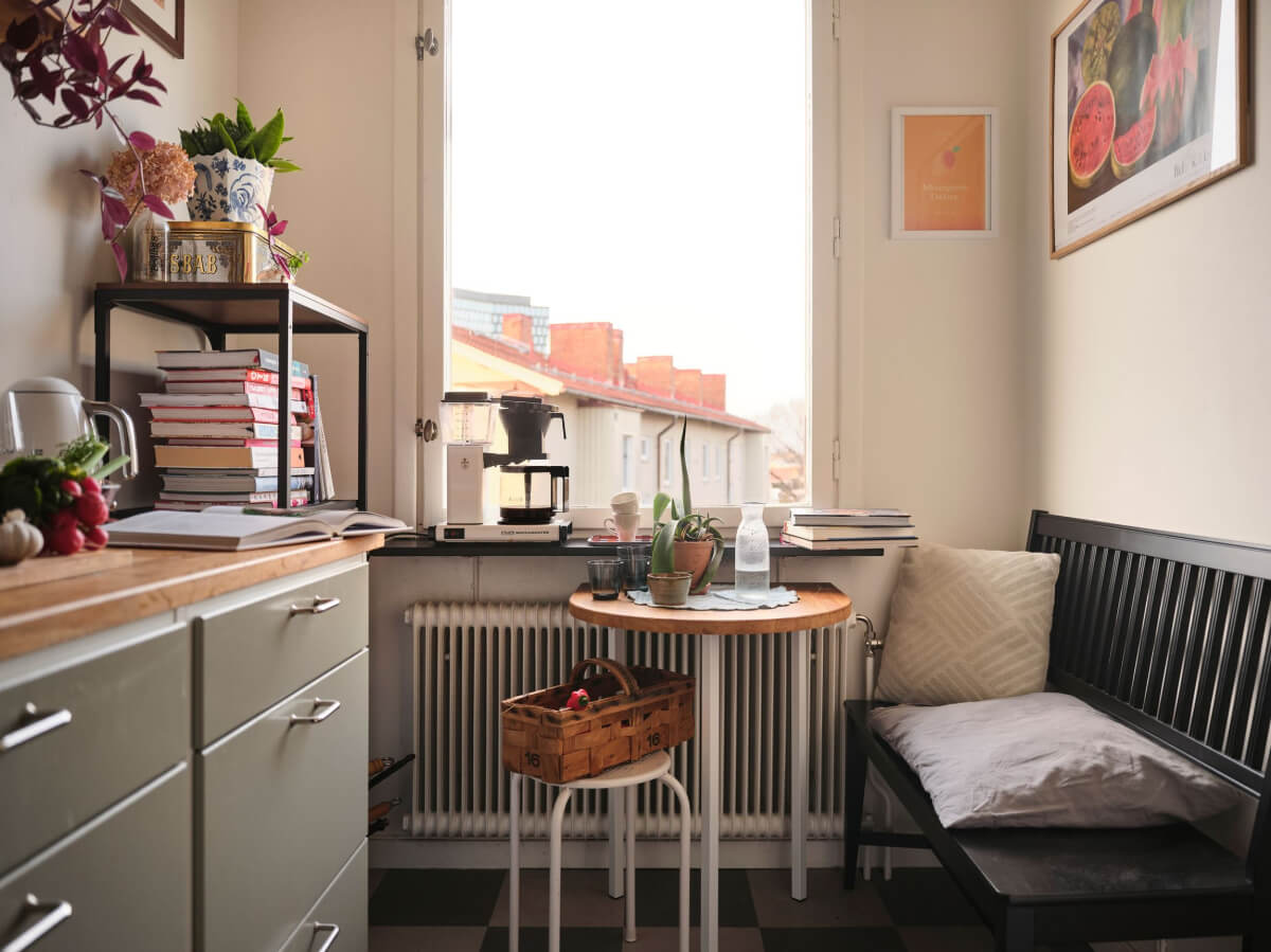 A Small, Light Swedish Apartment with Midcentury Features 15 small kitchen table with black bench