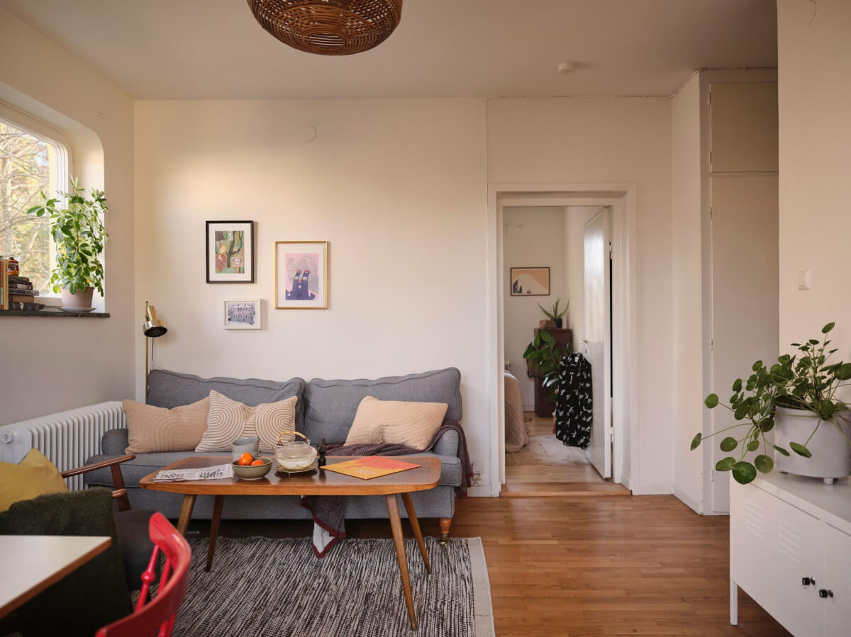 A Small, Light Swedish Apartment with Midcentury Features 10 small living room wooden floor