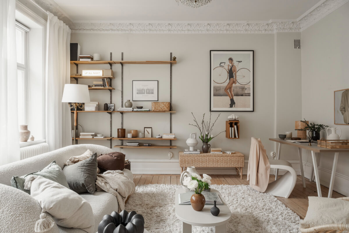 studio apartment light gray walls shelves desk