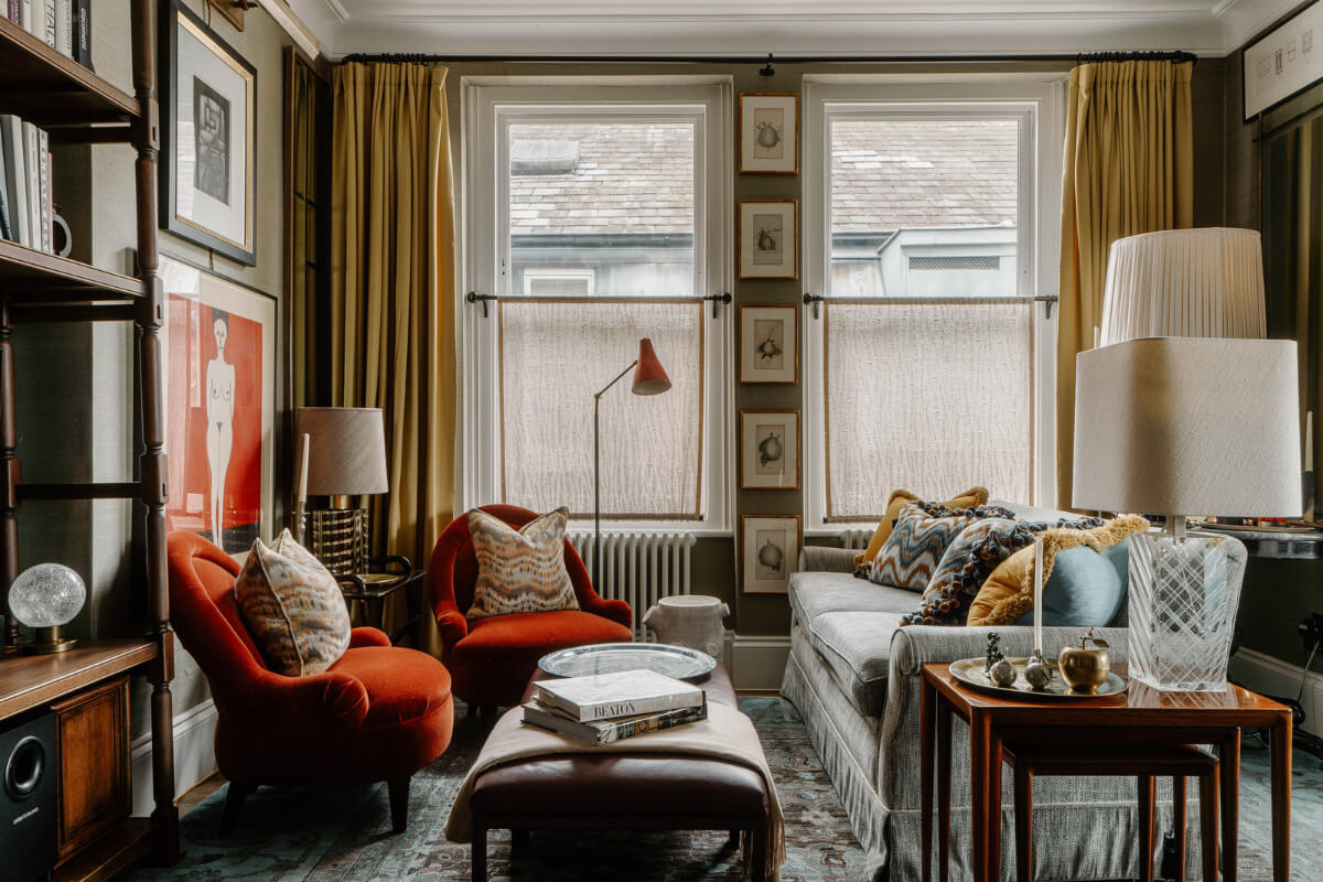 warm living room with art and ochre yellow curtains