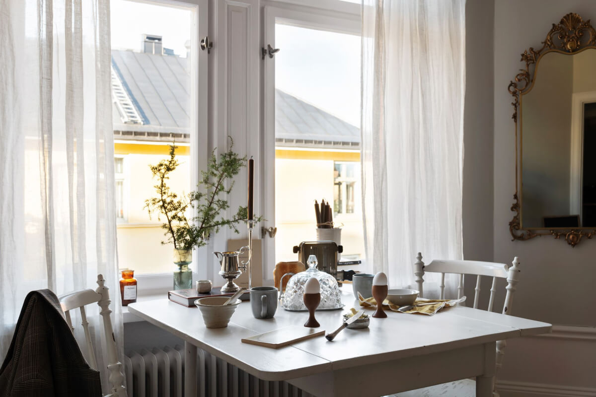 white vintage table under window scandi living room