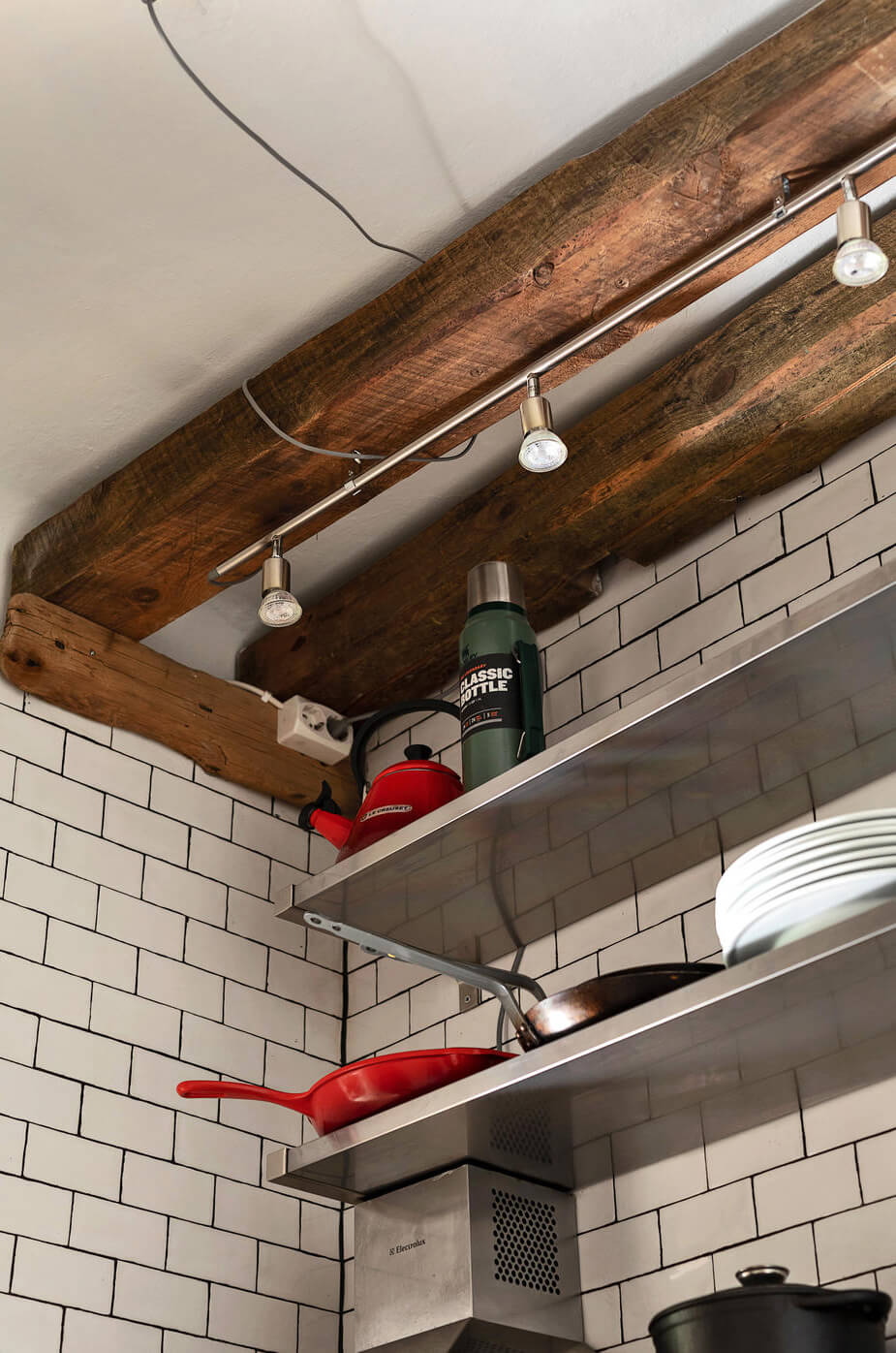 A Charming Studio Apartment with Leafy Courtyard Views 9 wooden beams detail