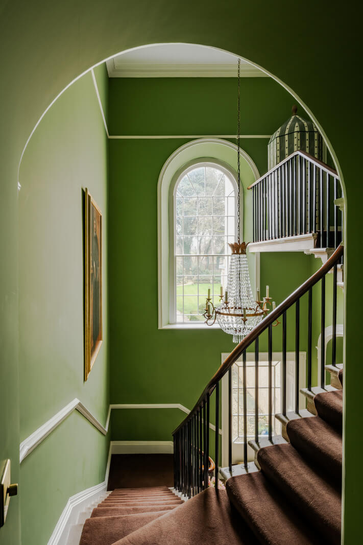 Period Features and Color in a Pretty Georgian House 12 arched doorway green staircase