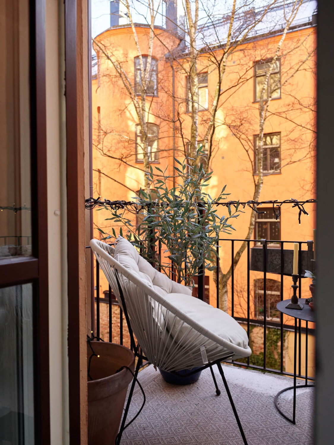 A Two-Bedroom Apartment with a Charming Bathroom 11 balcony chair