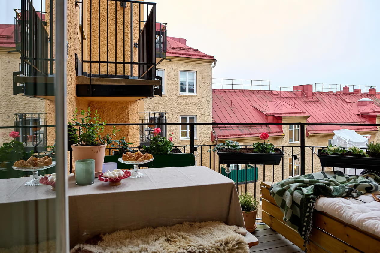 A Charming Swedish Apartment with a Spacious Balcony 8 balcony table