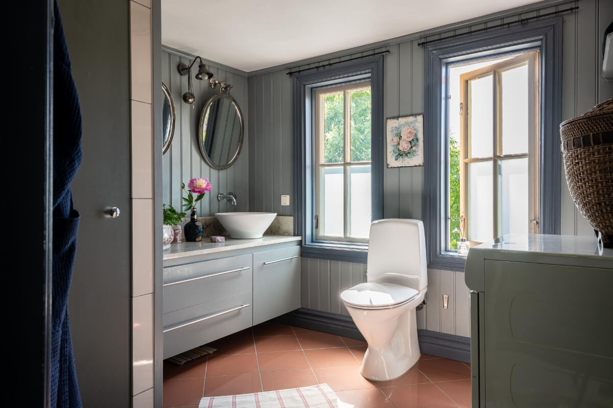 bathroom blue-gray wood paneled walls