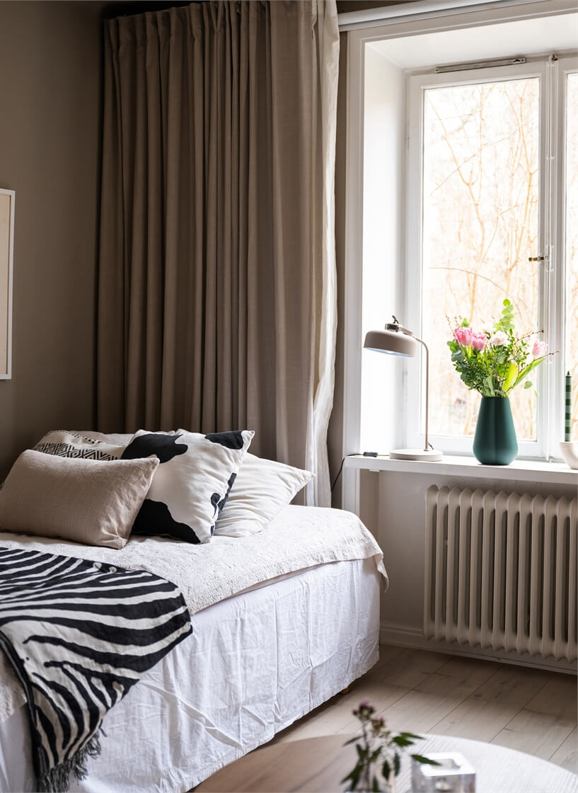 A Studio Apartment with Brown Walls 4 bed detail