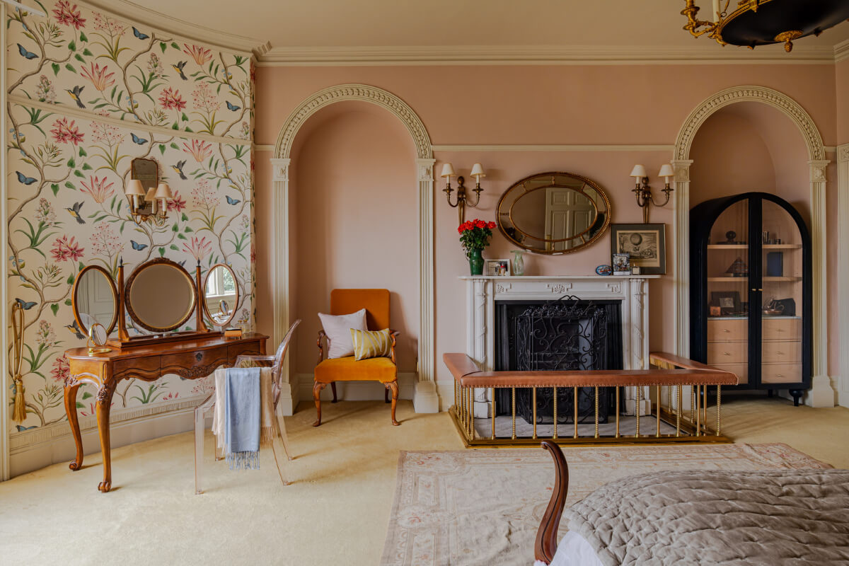 Period Features and Color in a Pretty Georgian House 17 bedroom floral wallpaper pink wall fireplace rounded niches