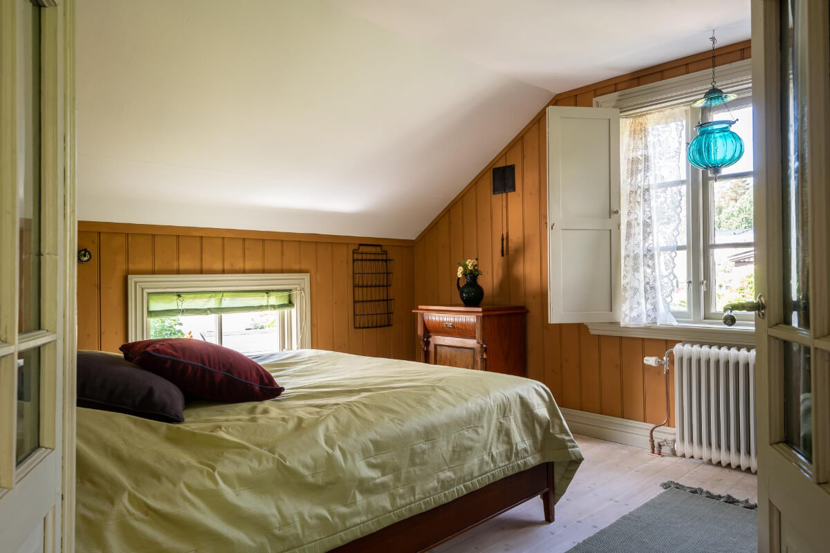 bedroom wood paneled walls wooden window shutters