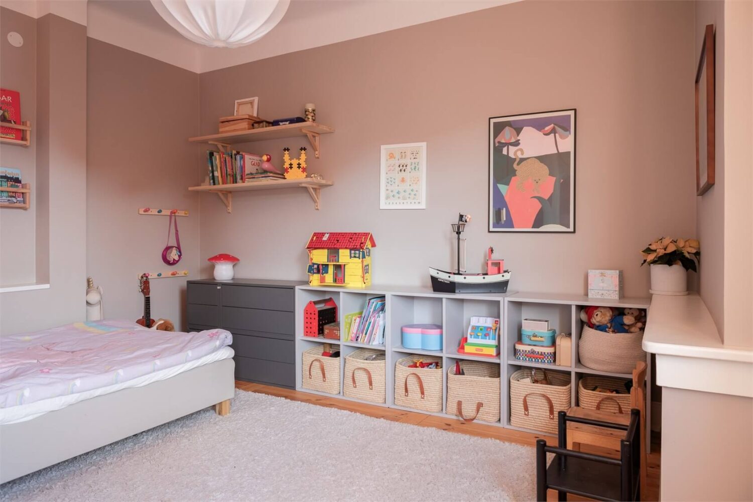 A Stockholm Apartment with a Light Yellow Kitchen 12 beige kids bedroom open storage