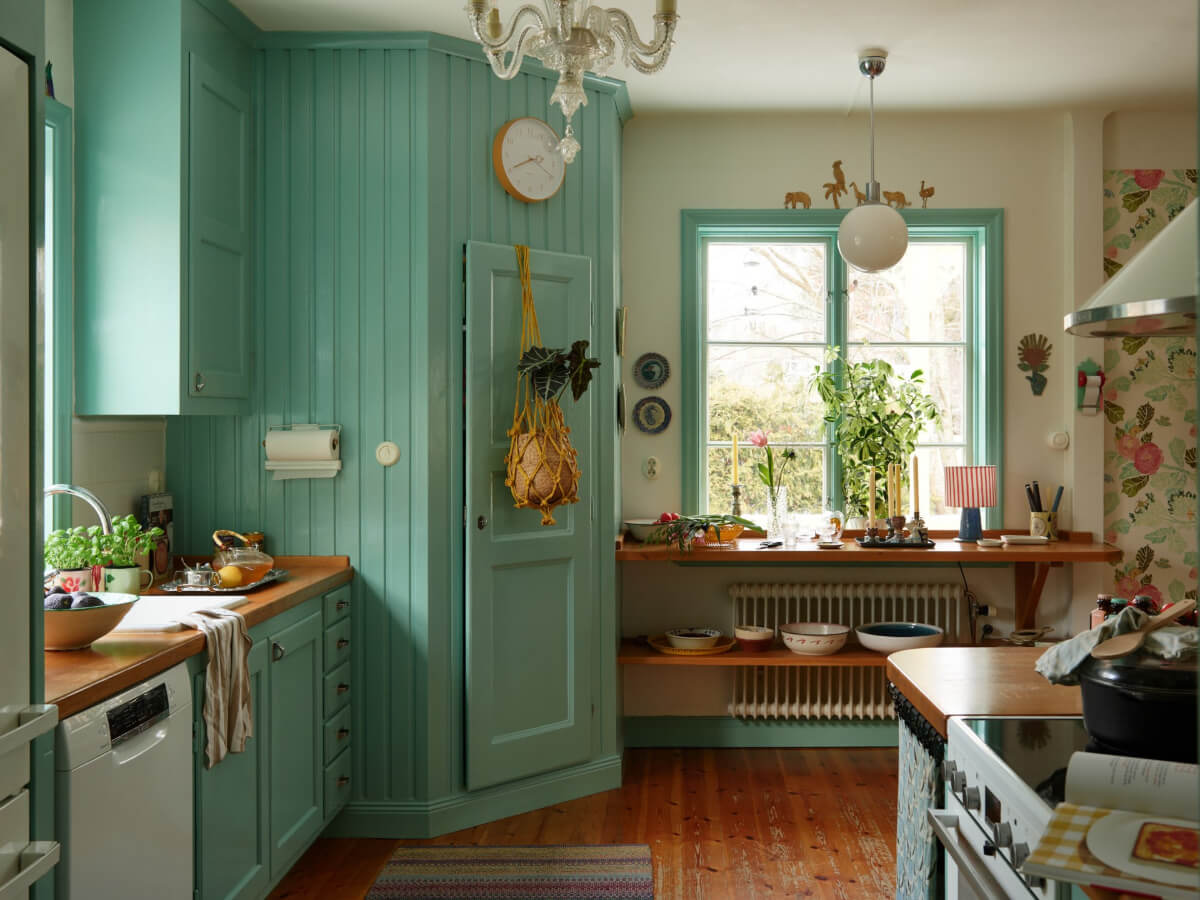 blue kitchen shelves under window