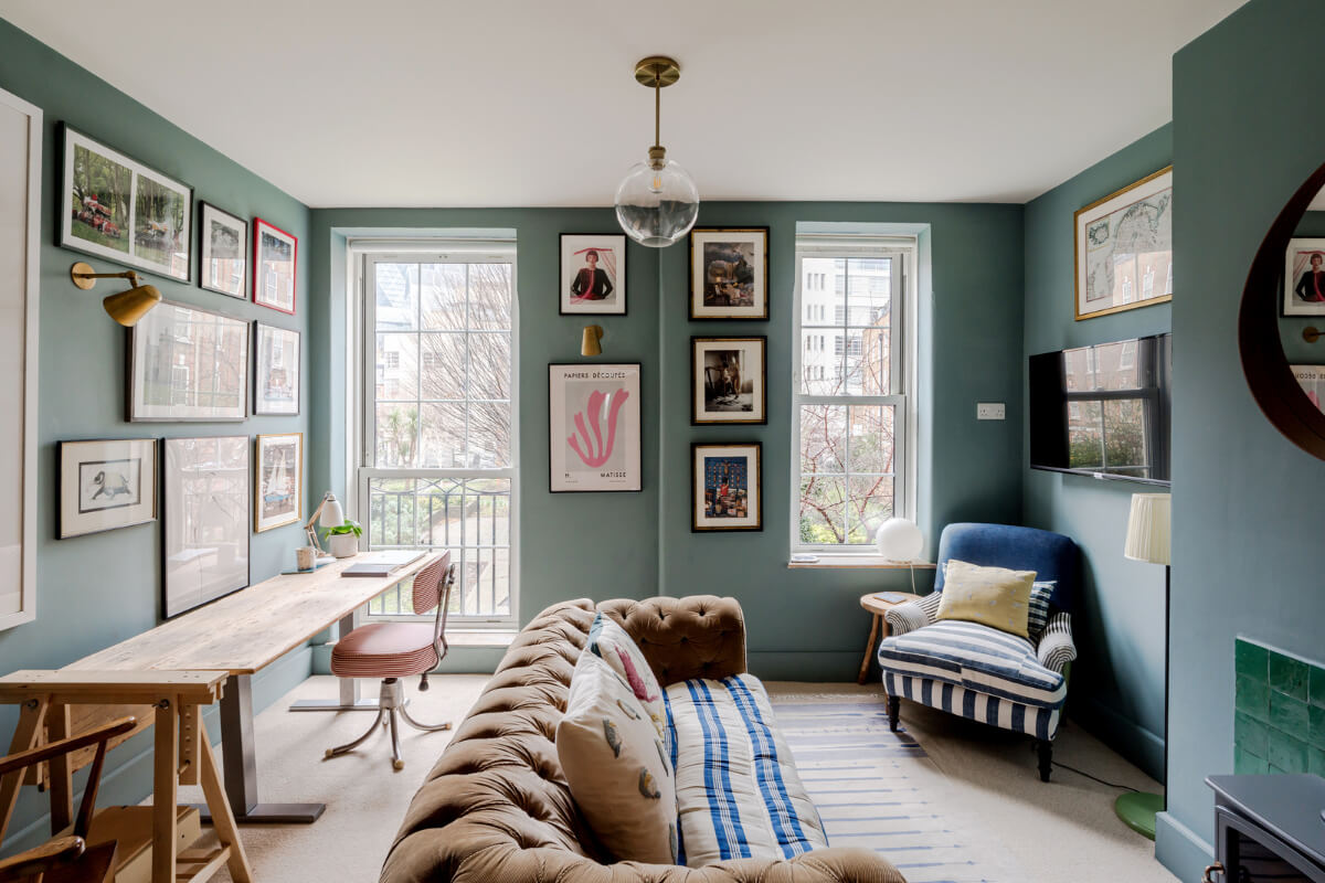 blue living room with wooden desk