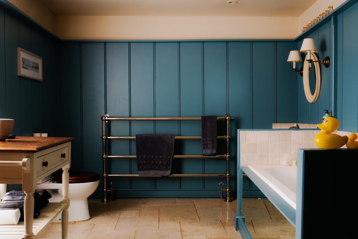 Period Features and Color in a Pretty Georgian House 24 blue paneled bathroom