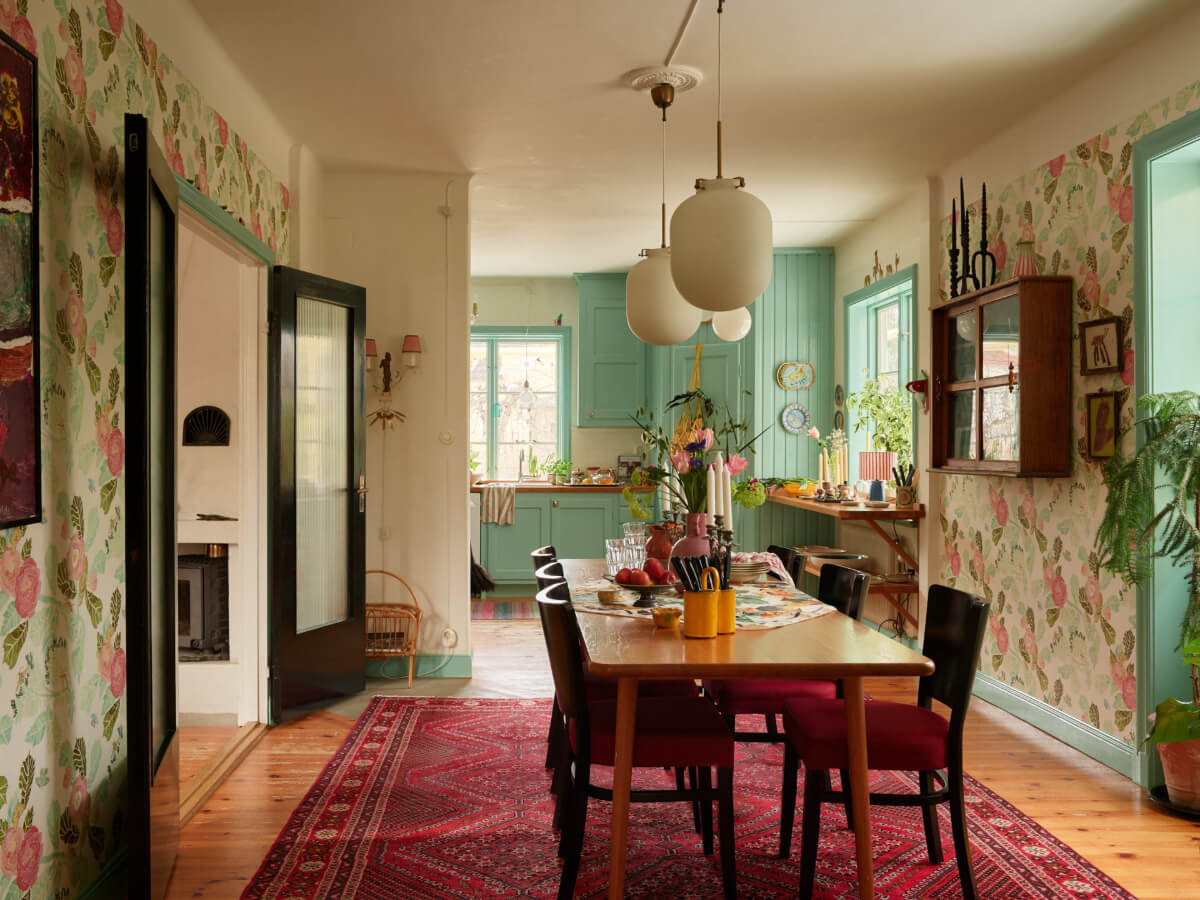 colorful open plan kitchen dining room floral wallpaper