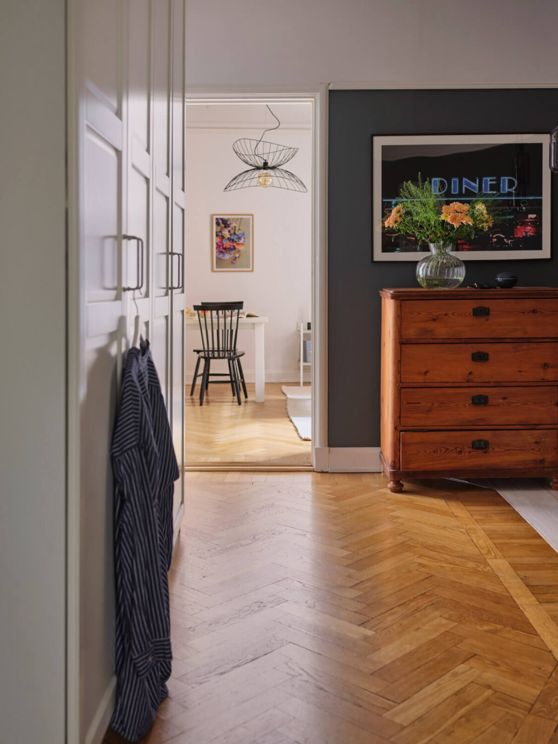 A Small Apartment with an Industrial Stainless Steel Kitchen 15 dark blue hall herringbone parquet floor
