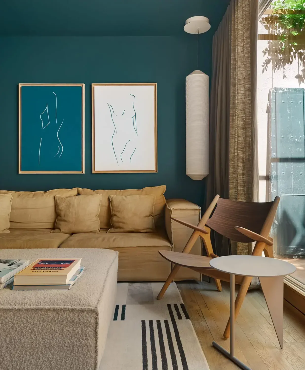 Colorful Contemporary Interiors in a 1930s Spanish House 2 dark blue sitting room ochre sofa