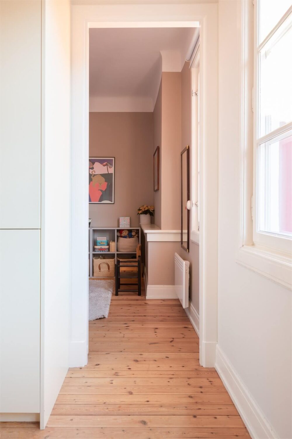 A Stockholm Apartment with a Light Yellow Kitchen 11 doorway into kids bedroom