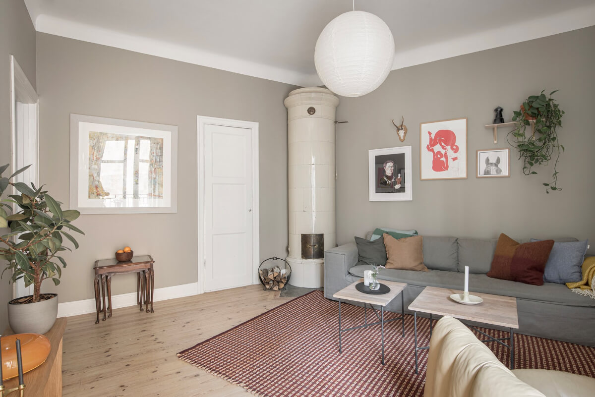 Rooms with Unique Shapes in a Lovely Swedish Apartment 3 fireplace gray scandi living room