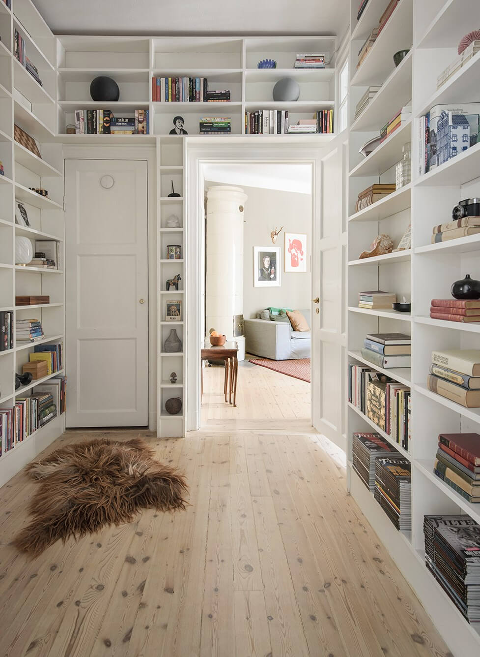 Rooms with Unique Shapes in a Lovely Swedish Apartment 11 floor to ceiling bookshelves hall