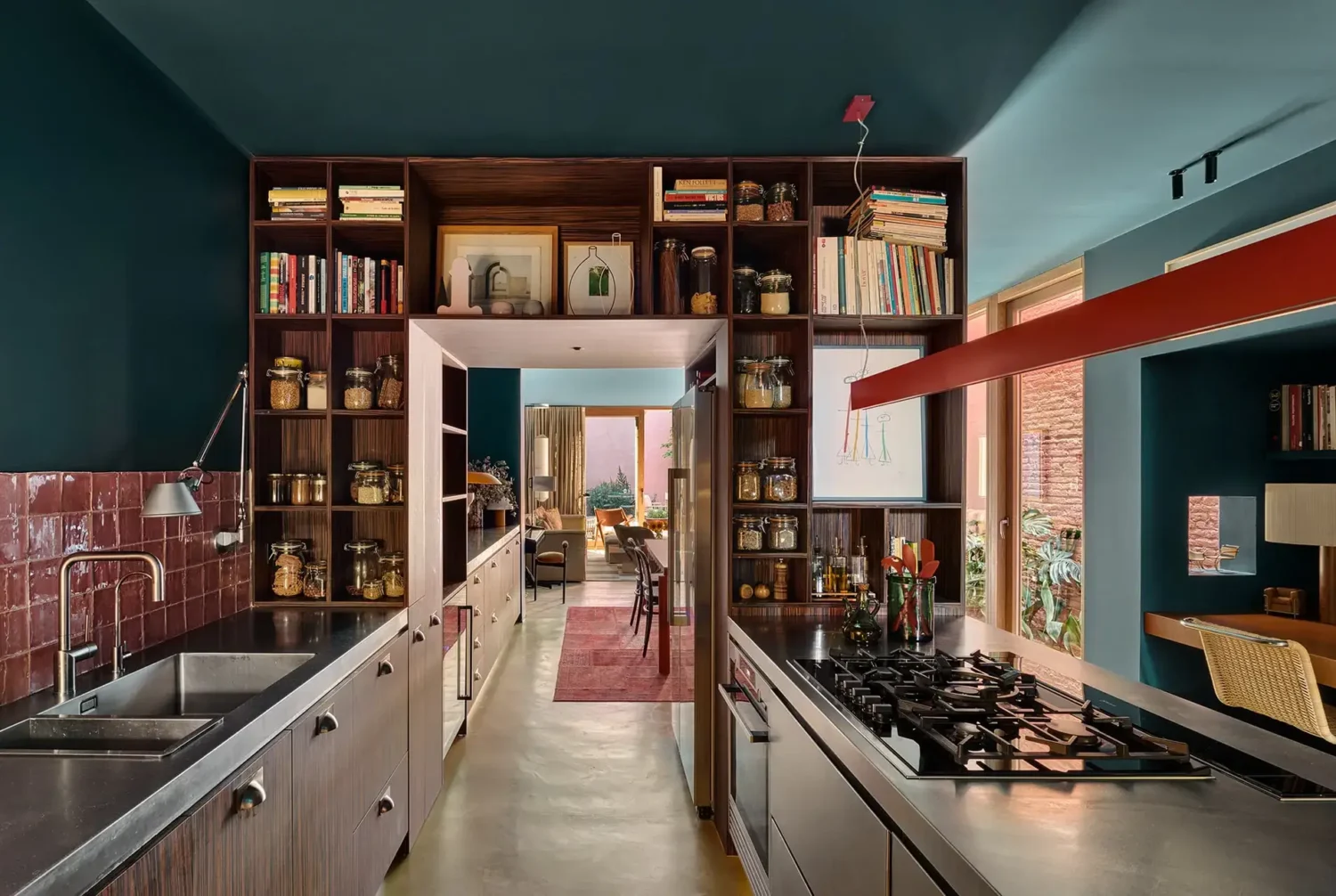 Colorful Contemporary Interiors in a 1930s Spanish House 6 galley kitchen pink backsplash tiles