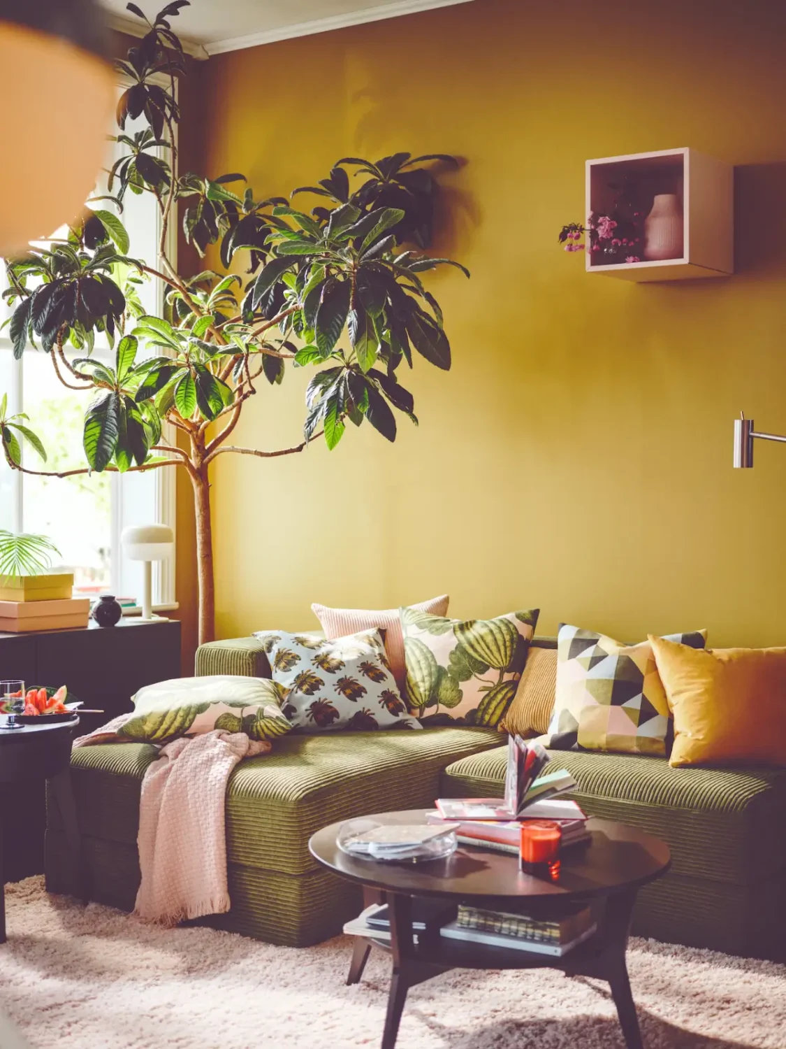 golden yellow wall living room green sofa color of the year 2026 predicition nordroom