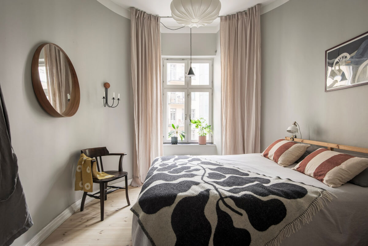 Rooms with Unique Shapes in a Lovely Swedish Apartment 17 gray bedroom rounded walls
