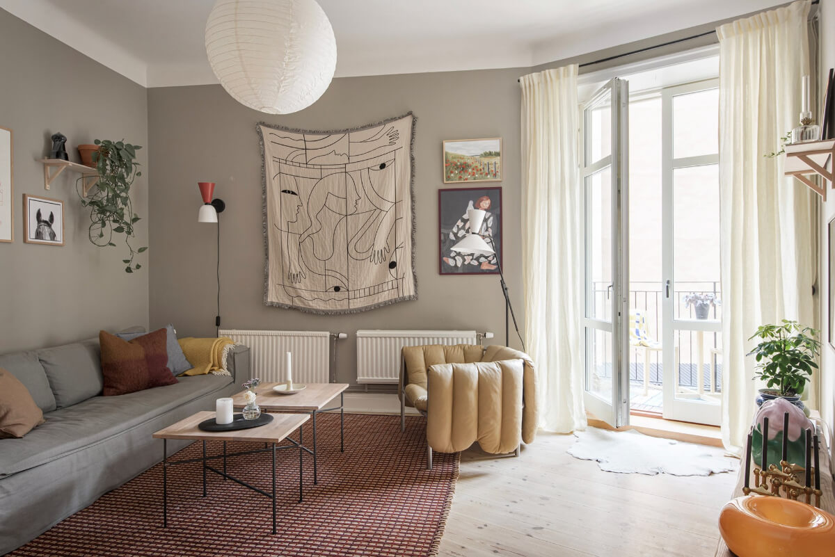 Rooms with Unique Shapes in a Lovely Swedish Apartment 2 gray living room glass balcony doors large rug