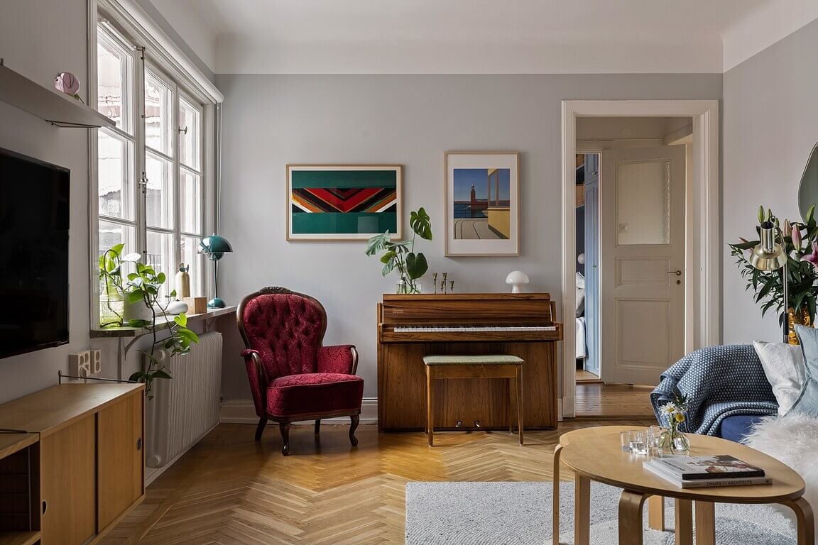A Stockholm Apartment with a Light Yellow Kitchen 3 gray living room parquet floor