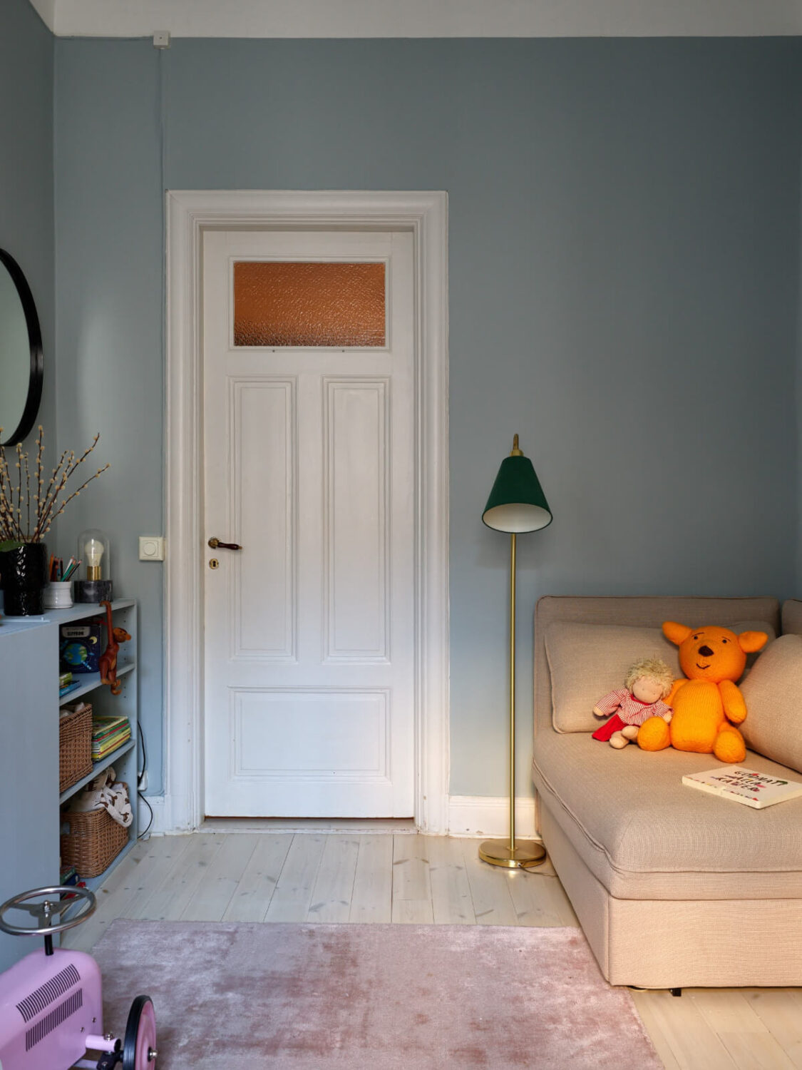 A Two-Bedroom Apartment with a Charming Bathroom 19 gray nursery with ikea ivar cabinets and corner chair