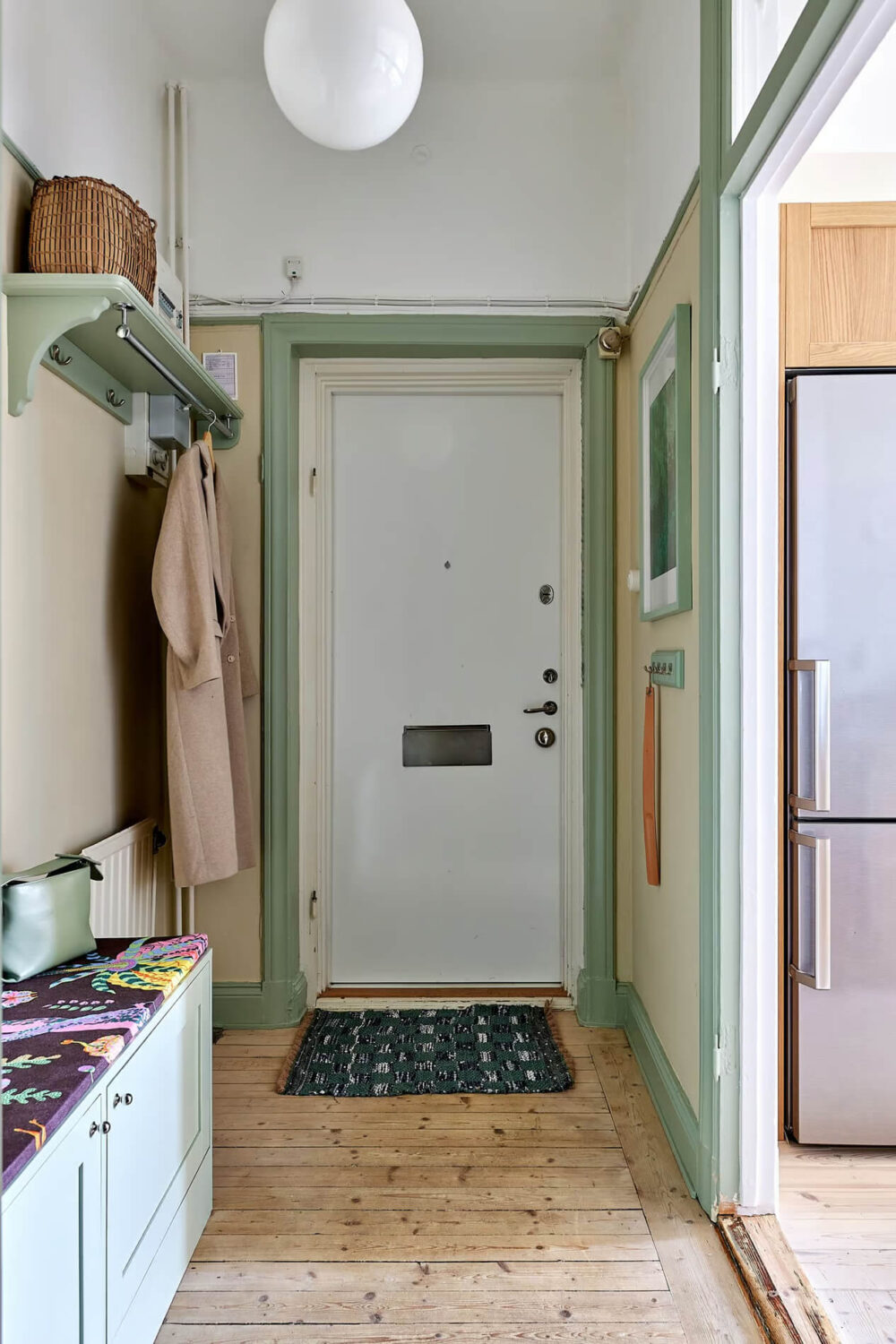 A Charming Swedish Apartment with a Spacious Balcony 24 hall green painted woodwork A Charming Swedish Apartment with a Spacious Balcony