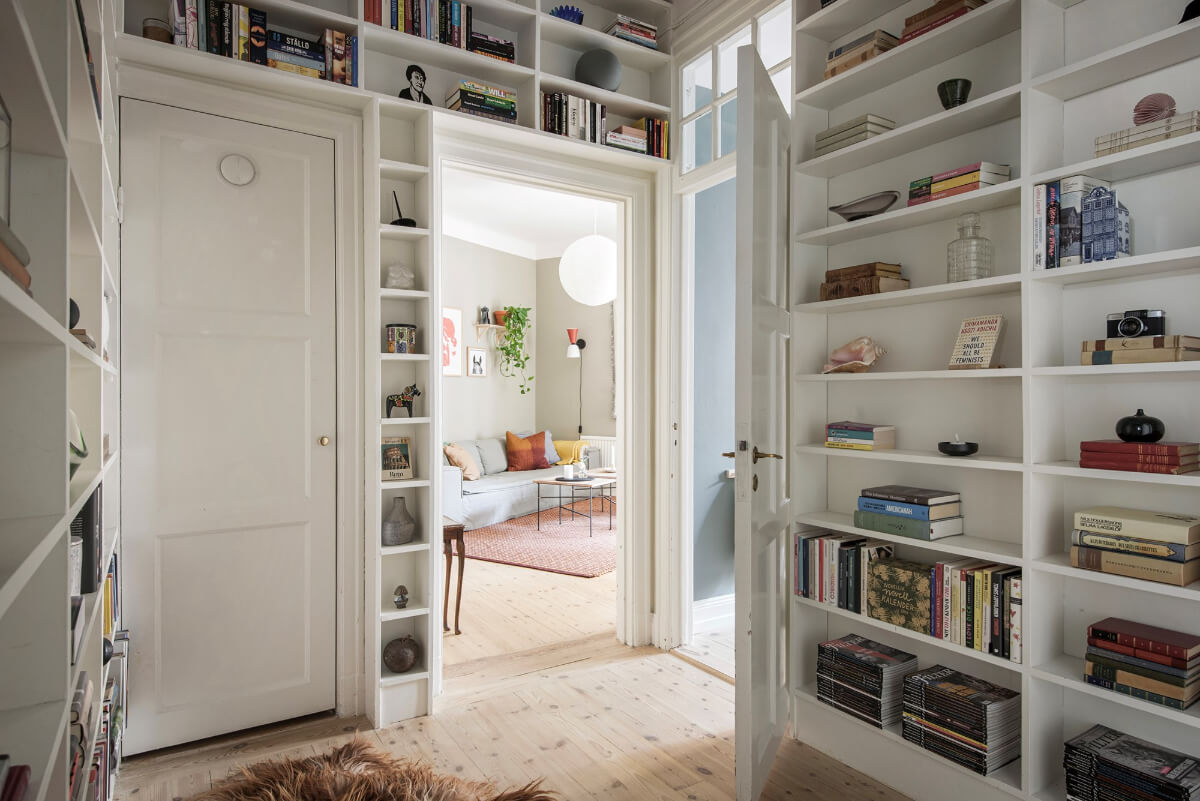 Rooms with Unique Shapes in a Lovely Swedish Apartment 12 hall with bookshelves