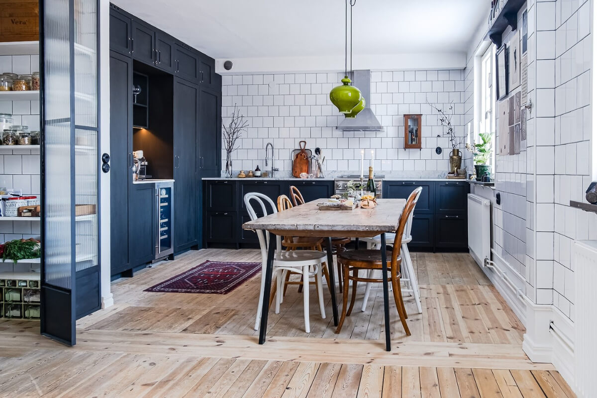 A Charming Duplex Apartment with a Stunning Kitchen 1 industrial style kitchen large rustic table white tiles