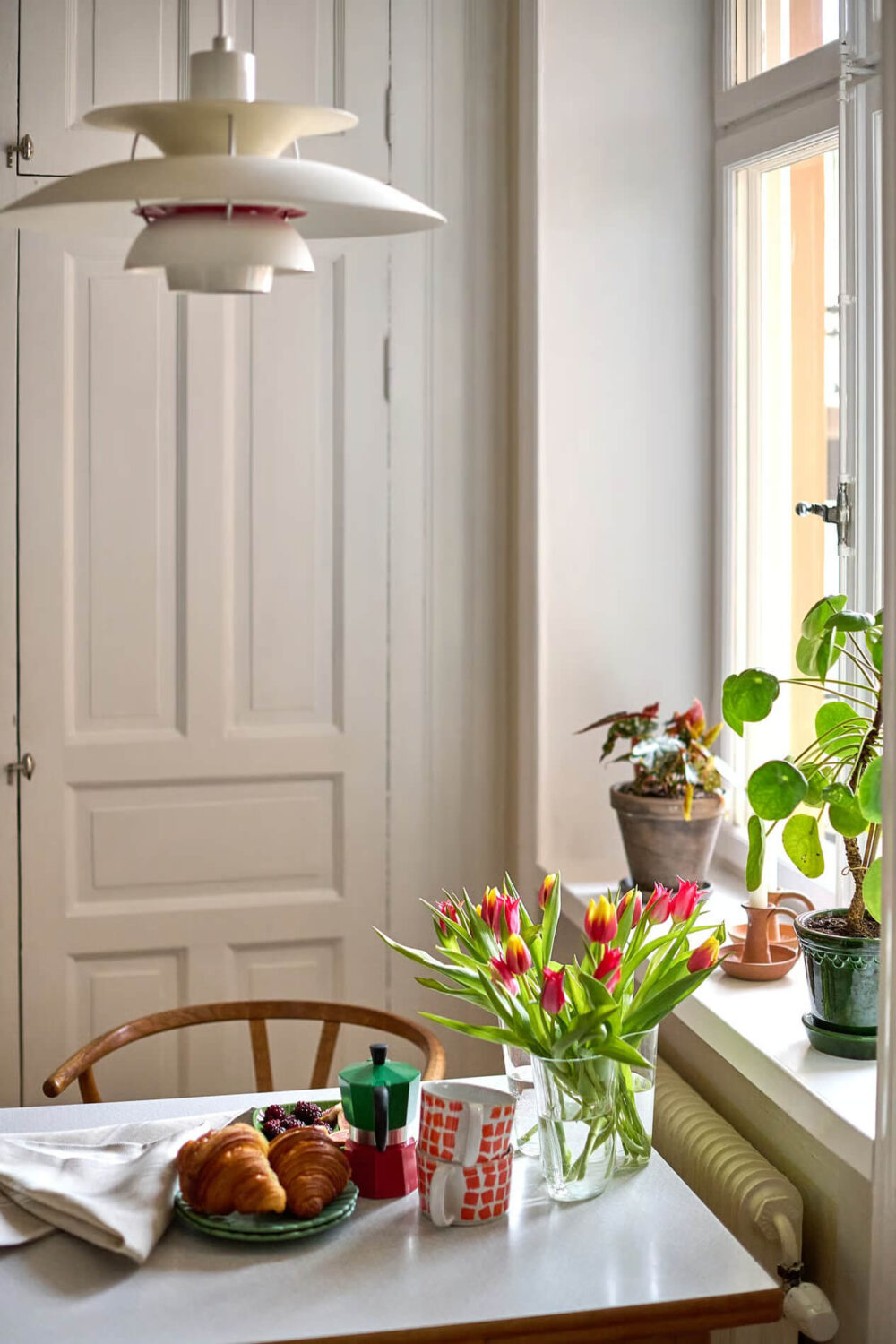A Charming Swedish Apartment with a Spacious Balcony 11 kitchen table