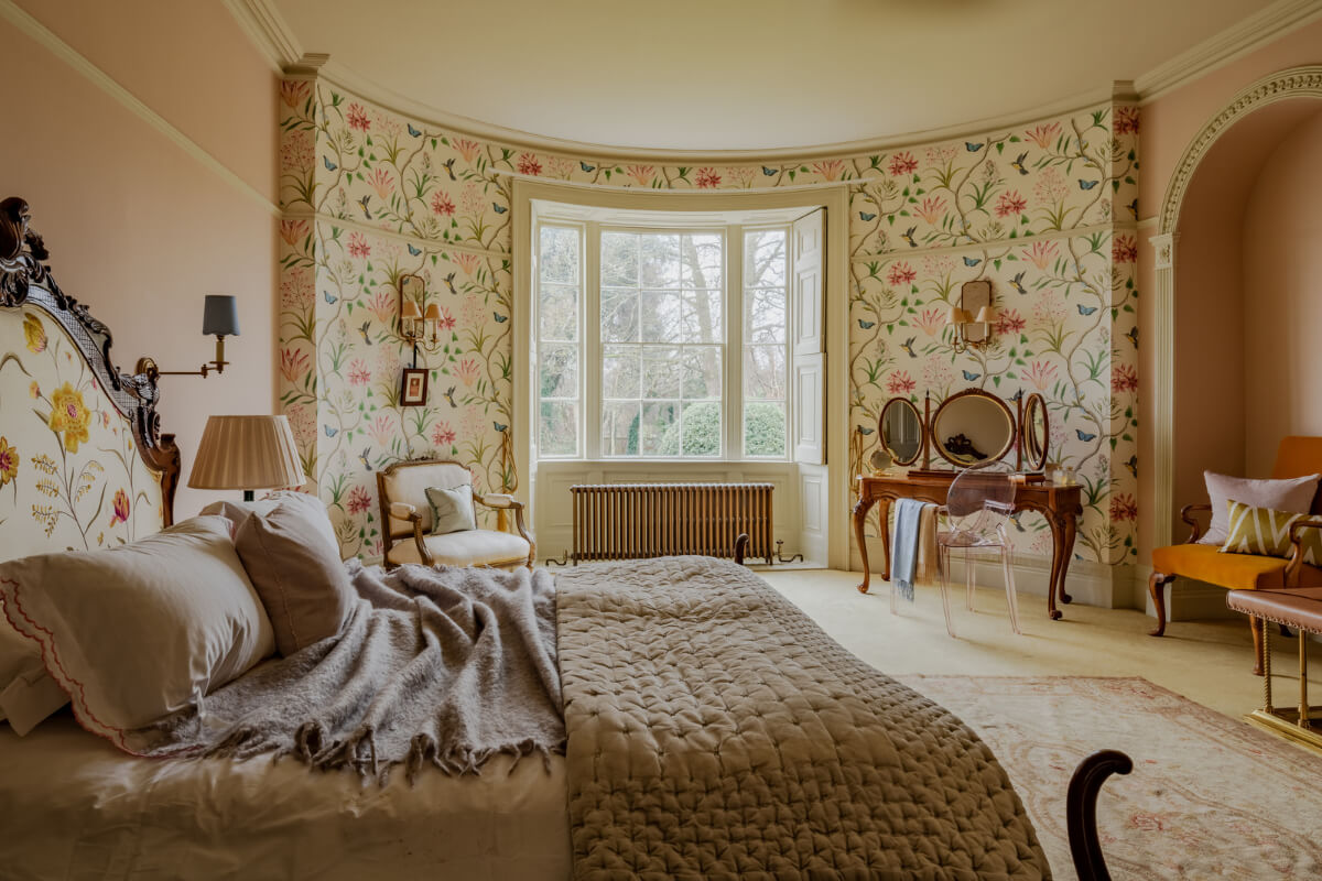 Period Features and Color in a Pretty Georgian House 16 large bedroom rounded wall floral wallpaper